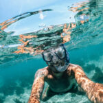 Man snorkelin on boat tour from Split